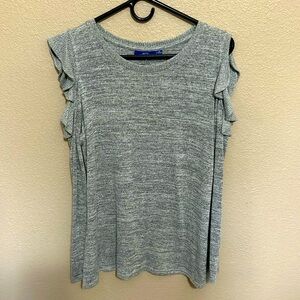 Women’s shirt with cut outs around the shoulder area.